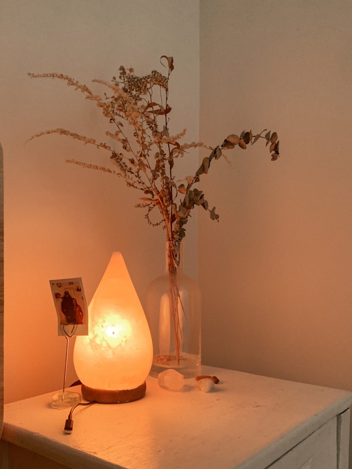 Vase with flowers and candle